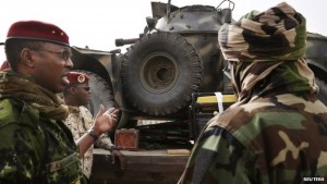 A Chadian military general inspects an armoured vehicle, which the Chadian military say was taken by them from insurgent group Boko Haram in Nigeria - 26 February 2015 Chadian troops have been instrumental in taking back towns from Boko Haram
